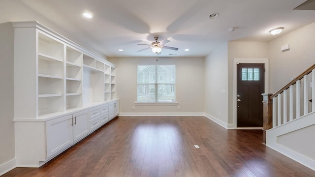 foyer entrance with ceiling fan and dark hardwood / wood-style flooring