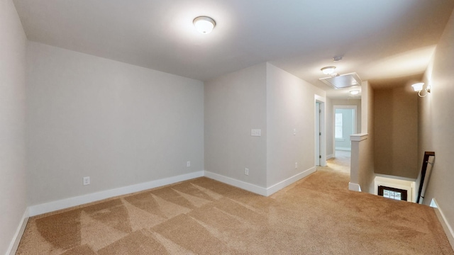 spare room with light carpet