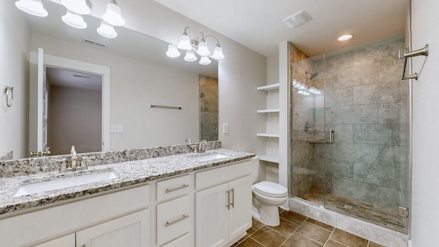 bathroom featuring vanity, toilet, and an enclosed shower