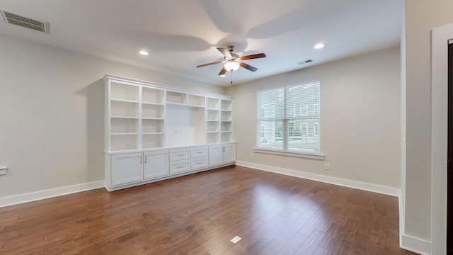 interior space with dark hardwood / wood-style flooring and ceiling fan