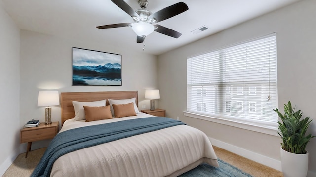 bedroom with ceiling fan and carpet flooring