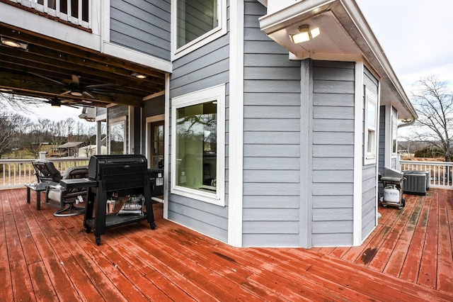 deck with central AC unit and ceiling fan