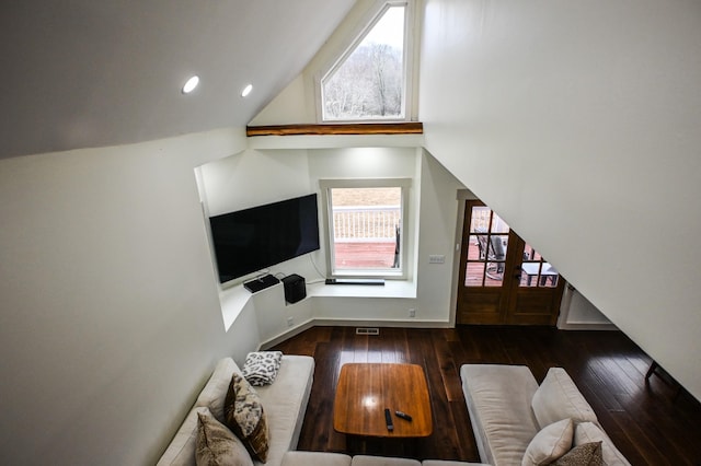 living room with dark hardwood / wood-style flooring and high vaulted ceiling