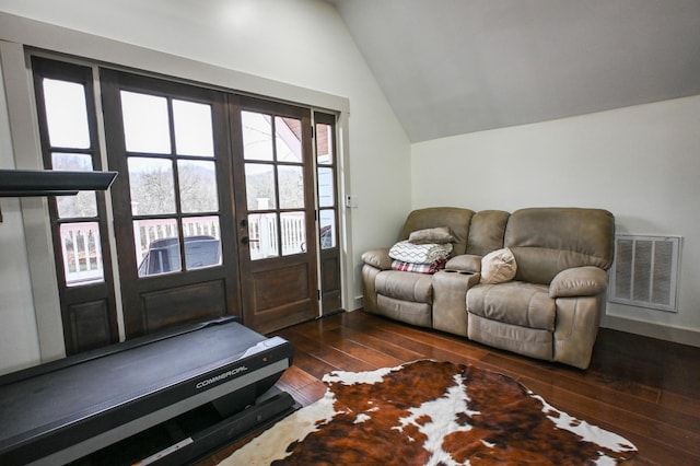 living room featuring french doors, lofted ceiling, and dark hardwood / wood-style flooring