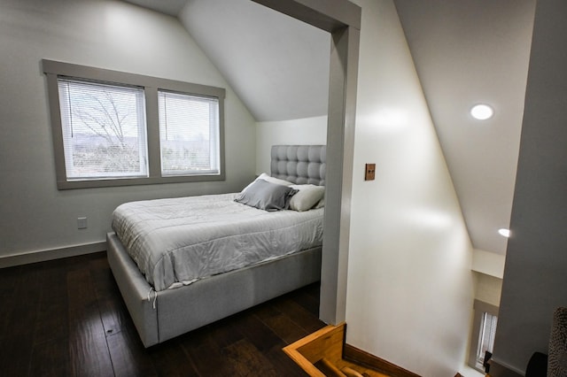 bedroom with lofted ceiling and dark wood-type flooring