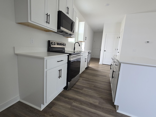 2391 Nelson Way, Cookeville, TN 38506 - kitchen with appliances with stainless steel finishes, dark wood finished floors, a sink, and white cabinets