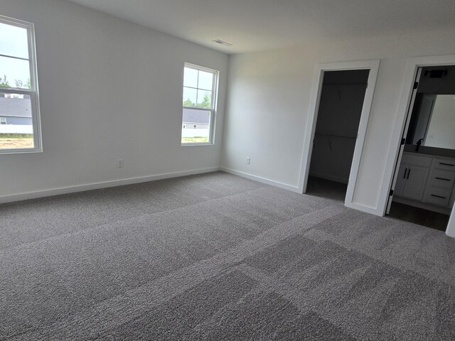 2391 Nelson Way, Cookeville, TN 38506 - unfurnished bedroom featuring carpet, baseboards, and a spacious closet