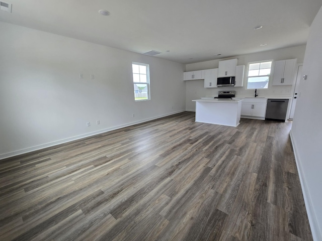 2391 Nelson Way, Cookeville, TN 38506 - unfurnished living room with a sink, plenty of natural light, dark wood-type flooring, baseboards, and recessed lighting