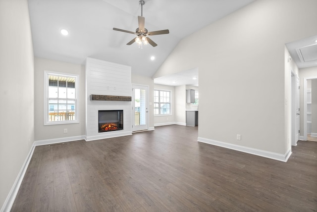 unfurnished living room with ceiling fan, high vaulted ceiling, a fireplace, and dark hardwood / wood-style flooring