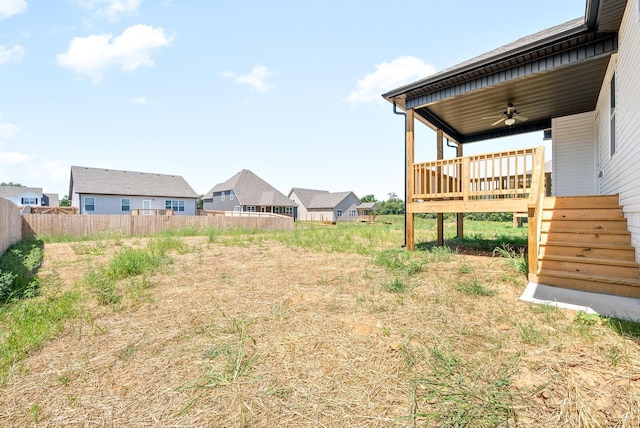 view of yard featuring ceiling fan