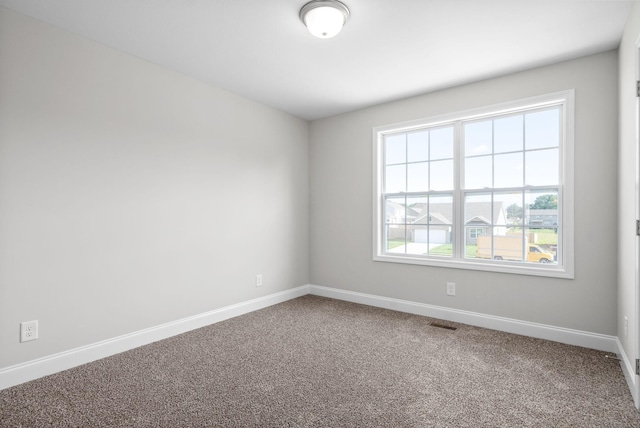 view of carpeted spare room