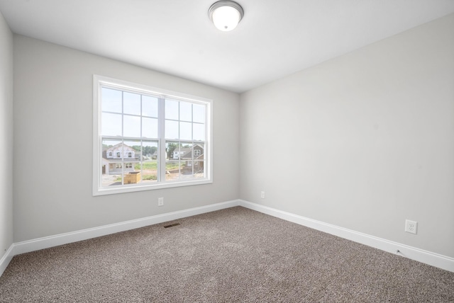 unfurnished room with carpet