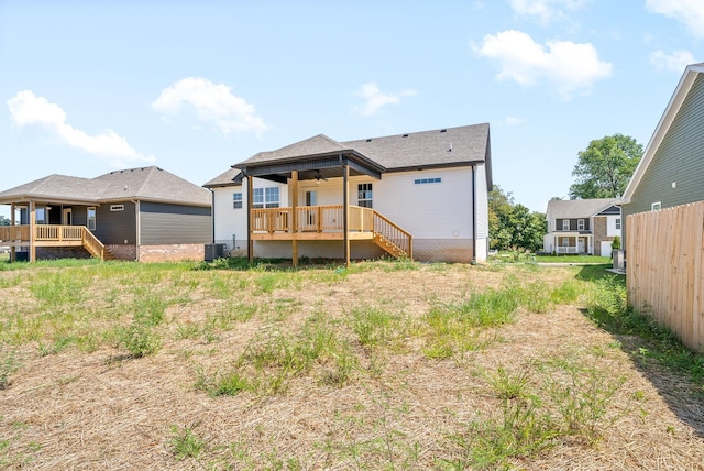 rear view of property with central AC unit, ceiling fan, and a deck