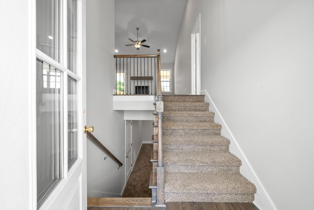 staircase with ceiling fan