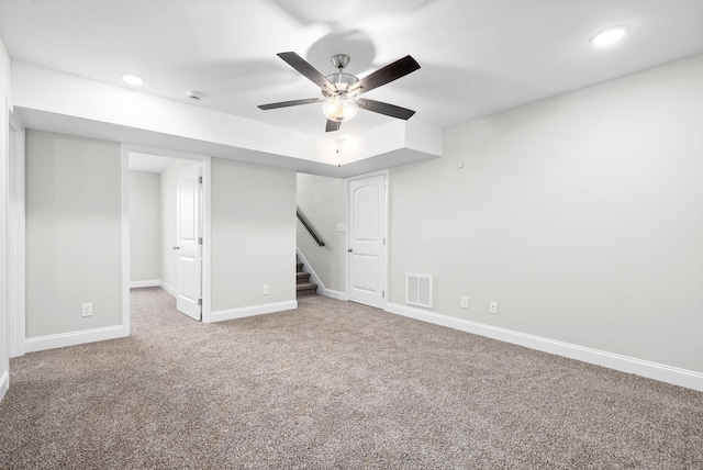 unfurnished bedroom with ceiling fan and carpet