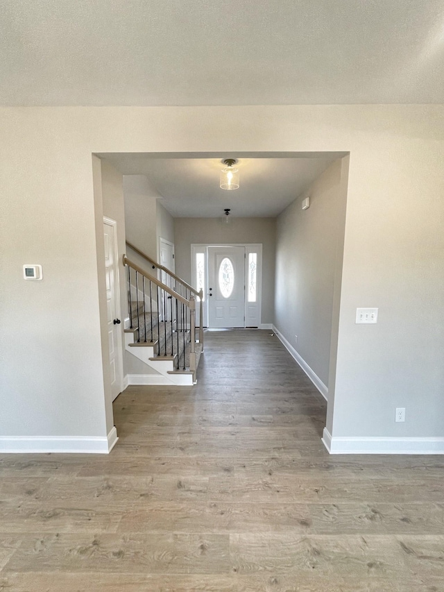 entryway with wood-type flooring