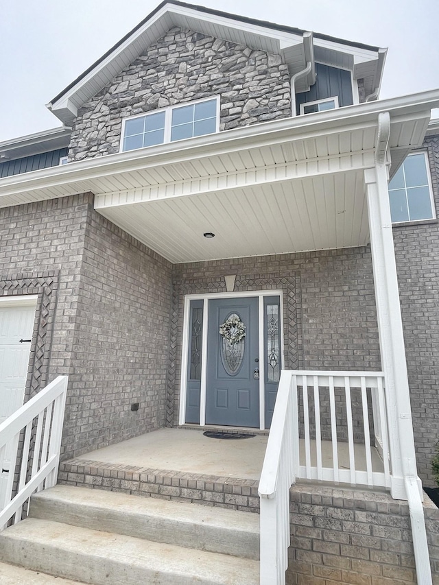 doorway to property featuring covered porch