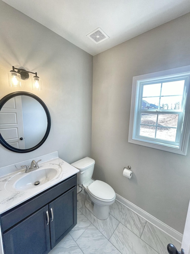 bathroom with vanity and toilet