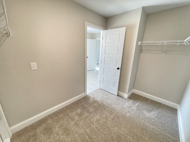 unfurnished bedroom featuring light colored carpet