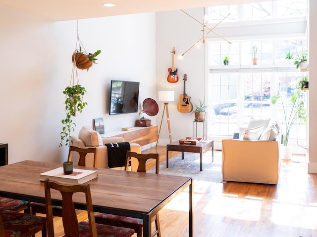 dining area featuring recessed lighting and wood finished floors