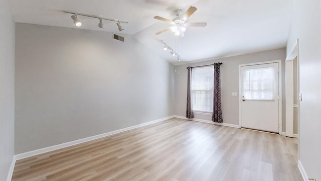 interior space featuring vaulted ceiling, ceiling fan, and light wood-type flooring