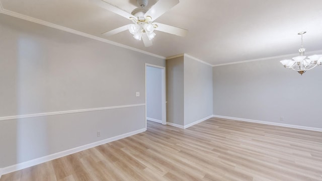 empty room with crown molding, ceiling fan with notable chandelier, and light hardwood / wood-style flooring