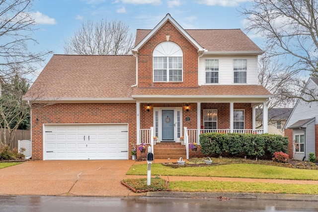 view of front of house with a garage and a front yard