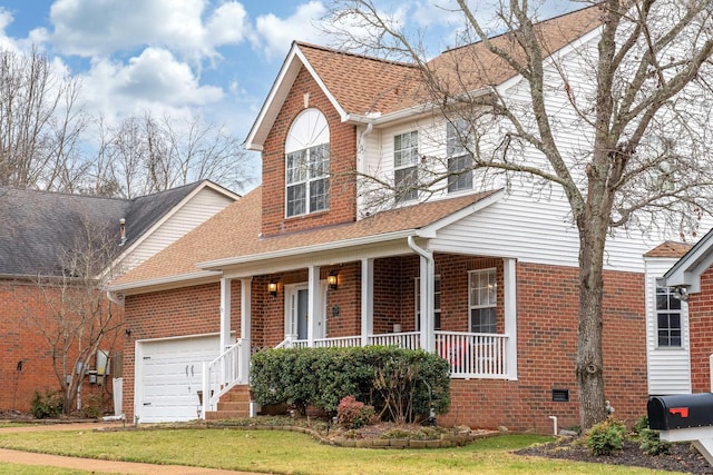 traditional home featuring brick siding, roof with shingles, covered porch, a garage, and a front lawn