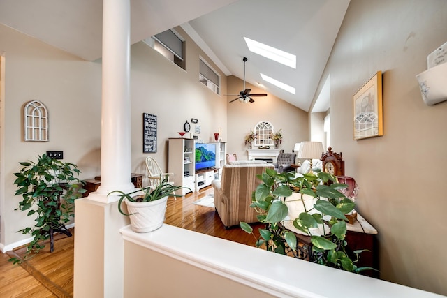 reception area with a skylight, ceiling fan, and ornate columns