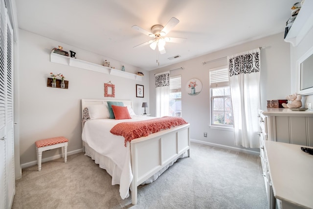 bedroom with ceiling fan and light colored carpet