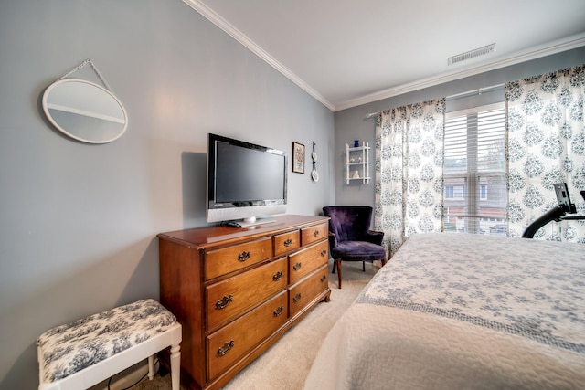 bedroom with crown molding and light colored carpet