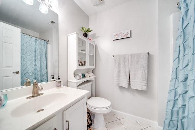 bathroom with vanity, a shower with shower curtain, tile patterned floors, and toilet