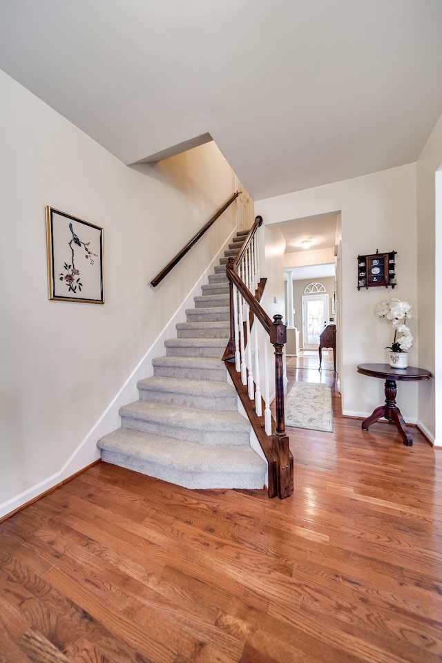 stairway with wood-type flooring