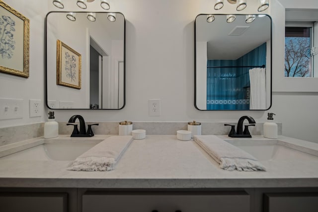 bathroom with vanity and a shower with shower curtain