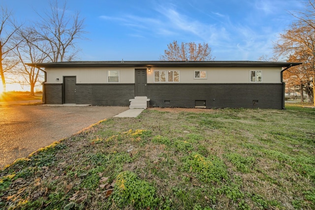 back of house with a yard