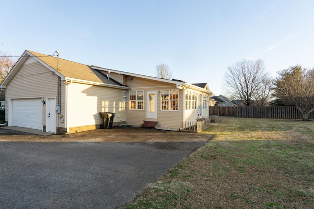 view of front of home with a garage and a front yard