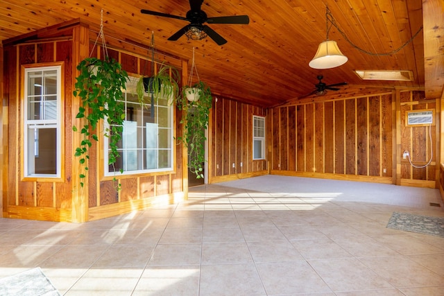 tiled spare room with ceiling fan, vaulted ceiling, and wooden ceiling