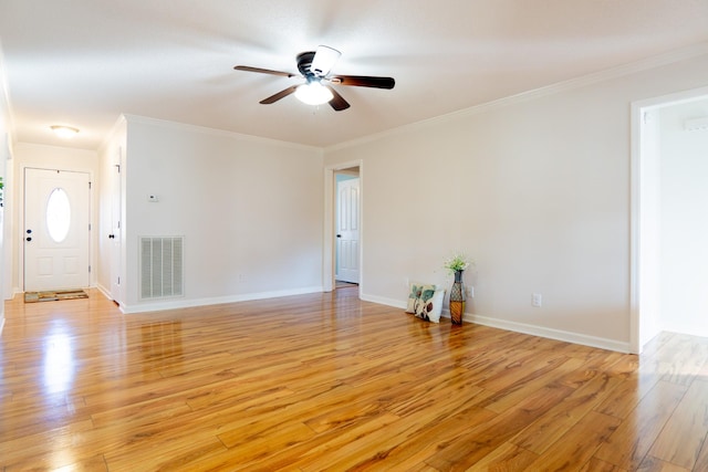 unfurnished living room featuring crown molding, ceiling fan, and light hardwood / wood-style floors