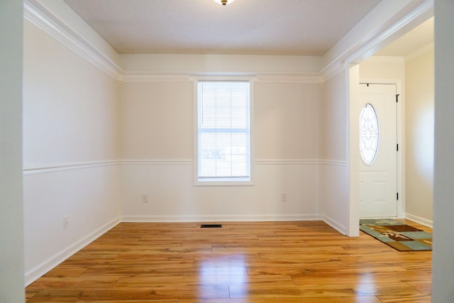 entrance foyer with plenty of natural light and light wood-type flooring