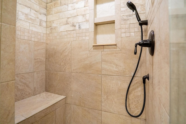 bathroom featuring a tile shower