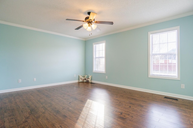 spare room with crown molding, dark wood-type flooring, ceiling fan, and a textured ceiling