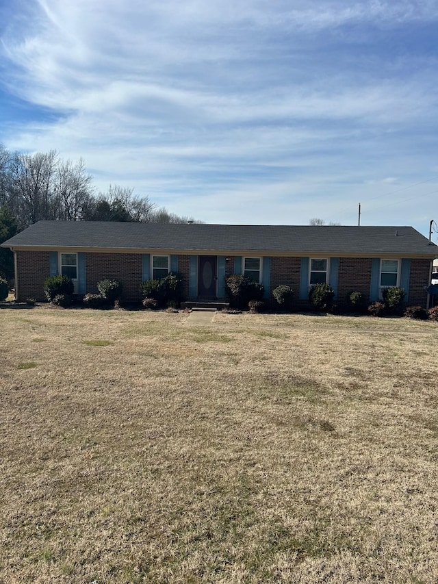 ranch-style home with a front lawn