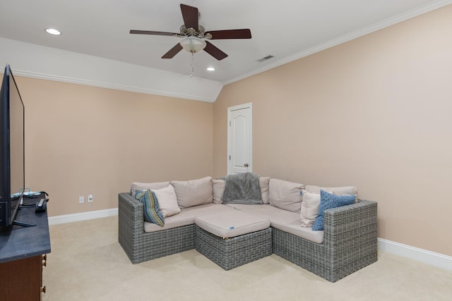 carpeted living room featuring crown molding, vaulted ceiling, and ceiling fan