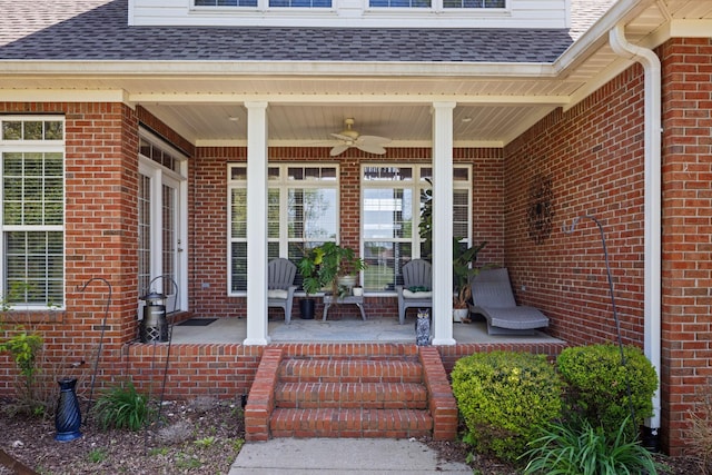 doorway to property with ceiling fan and covered porch