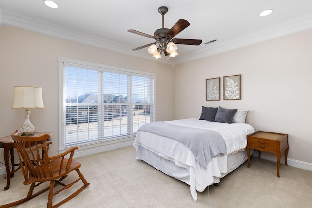 bedroom with light carpet, ornamental molding, and ceiling fan