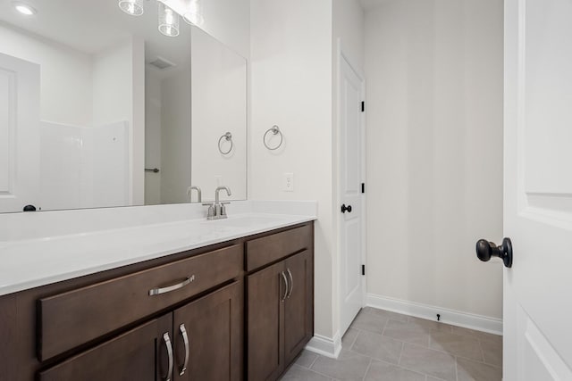 bathroom featuring vanity and tile patterned flooring