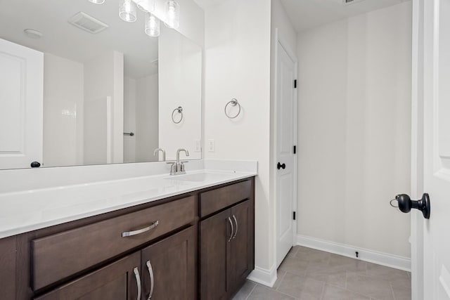 bathroom with vanity and tile patterned flooring