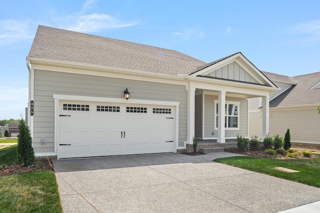 view of front of house featuring a garage and a front yard