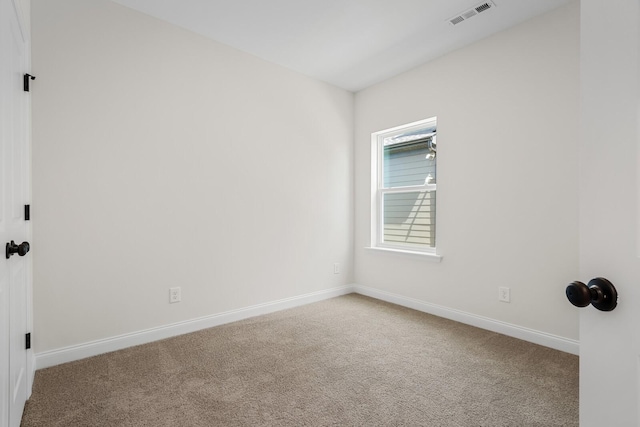 spare room with carpet floors