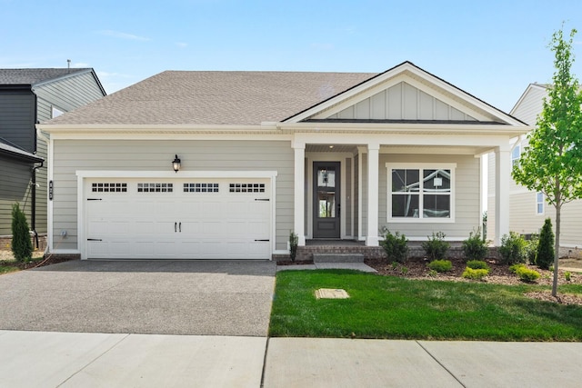 view of front of home featuring a garage and a front yard